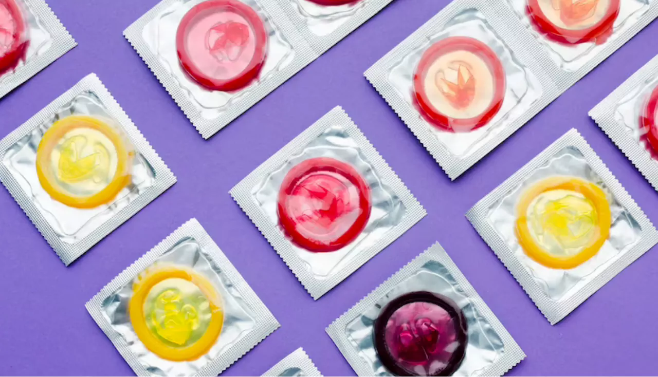 Flat lay arrangement of contraception concept on purple background